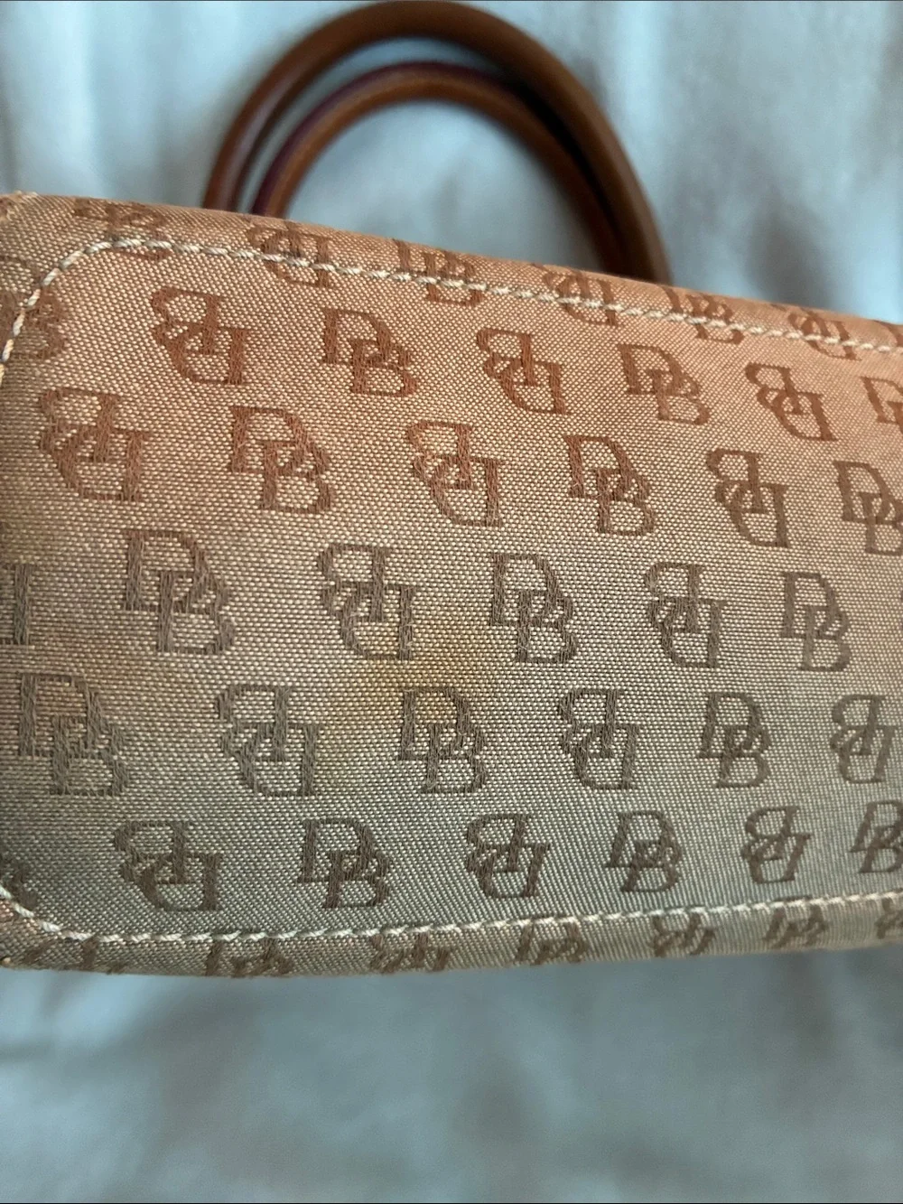 Dooney & Bourke  Brown Monogram Handbag with Tassel Accent